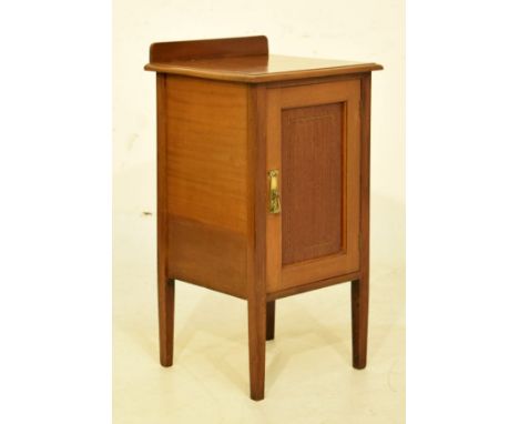 Early 20th Century inlaid mahogany bedside cabinet or pot cupboard with panelled door enclosing shelf   Condition: 