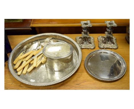 Small group of silver plated wares to include; pair of plate on copper table candlesticks, circular gallery tray, oval tea ca