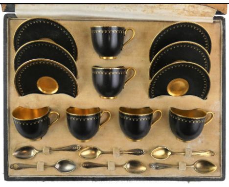 A Royal Worcester coffee cup, and saucer set together with silver gilt spoons, date code for 1916, with Viking Longship mark,