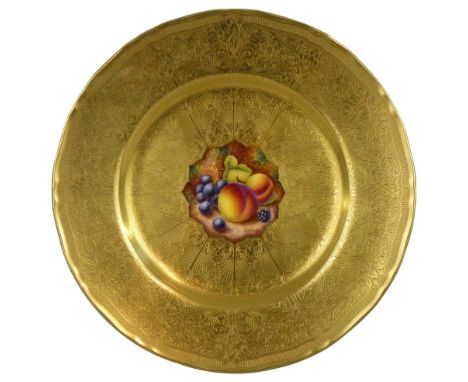 A Royal Worcester cabinet plate, gilt decorated with hand painted fruit to the centre, signed D. Shinnie, 27.5 cm diameter.