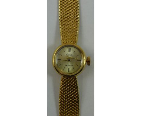 Exepta - a ladies 18k gold manual wind wristwatch, with silvered dial, to a woven bracelet, weight without the movement 25 g.