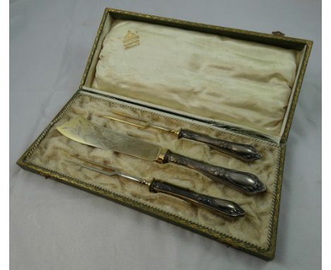 A German 800 standard silver Art Nouveau three piece serving set, bearing control marks, the handles with embossed floral dec