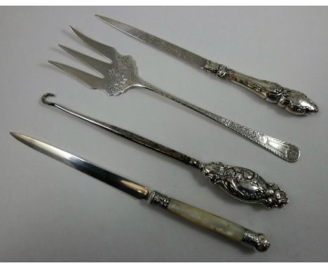 An Edwardian silver and mother of pearl letter opener, Sheffield 1904, another Sheffield 1889, a silver pastry fork and a sil