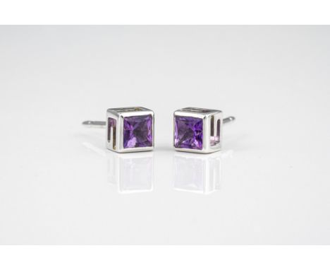 A Gucci 18ct white gold and amethyst pendant and matching stud earrings, the square cut amethysts within cube form settings p
