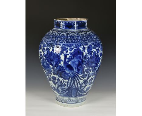 A massive Chinese blue and white porcelain jar, in the Kangxi style, possibly 18th / 19th century, stoutly potted, of octagon