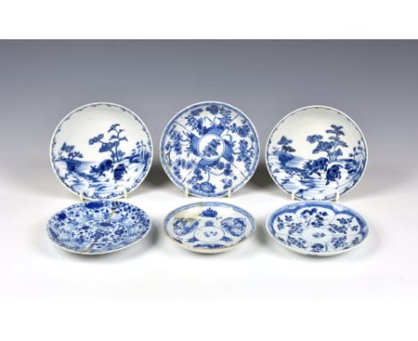 A pair of Chinese porcelain blue and white small saucer dishes, 18th century, painted with a landscape with a pair of water b