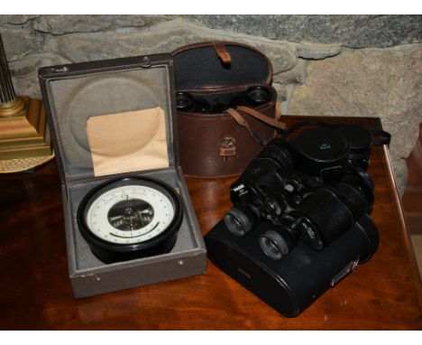 A cased Russian barometer, together with two pairs of binoculars and two 35mm. camera lenses. (5)