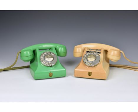 A vintage green bakelite telephone, probably 1950s, green cord and junction box, stamped to top with 'TEL' within a segmented