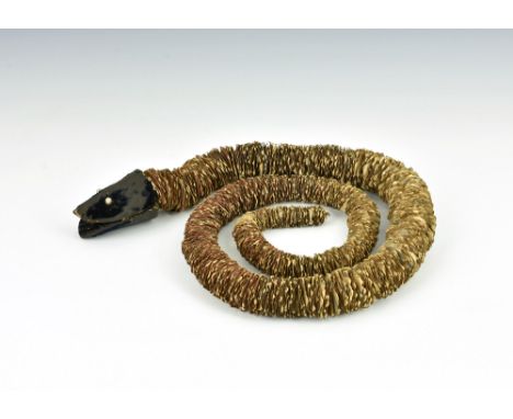 A Victorian philatelic novelty stamp snake, c.1870, composed of clipped and graduating Penny Reds, felt head with red wool to