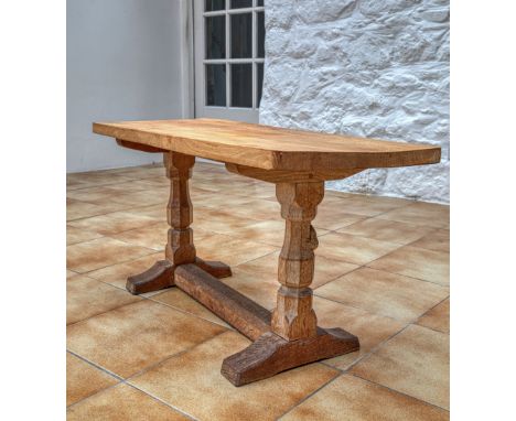 A Robert Mouseman Thompson of Kilburn refectory style coffee table, the rectangular top with rounded angles, raised on shaped