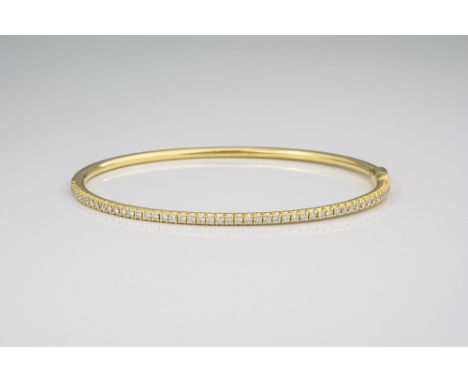 A Tiffany &amp; Co. 18ct yellow gold and diamond 'Metro' bangle, set with fifty brilliant cut diamonds, total approx. 0.50ct,