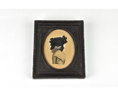 Buckall / Bucknall family interest - a late 18th century portrait silhouette of a lady, oval, with gum Arabic highlighting to