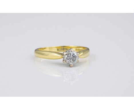 An 18ct yellow gold and diamond solitaire ring, the approx. 0.30ct brilliant cut diamond in a crown setting, ring size I. 