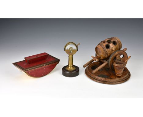 A novelty cast brass cigar cutter in the form of a ships telegraph, probably German, early 20th century, 5in. (12.7cm.) high,