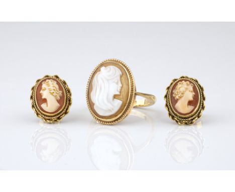 A 9ct gold shell cameo ring, size L; together with a matched pair of stud earrings with rope twist borders. (3) 