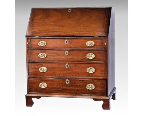 A George III mahogany bureau, the fall front enclosing a fitted interior with green gilt tooled leather and central cupboard 