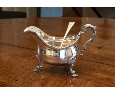A large Victorian sauce boat, Charles Stuart Harris, London, 1891, gadrooned rim, shell feet & acanthus scroll handle, 8in. (