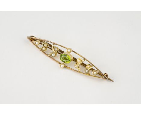 A Victorian 9ct gold, peridot and seed pearl brooch, elliptical with central oval cut peridot and half pearl set paired leave