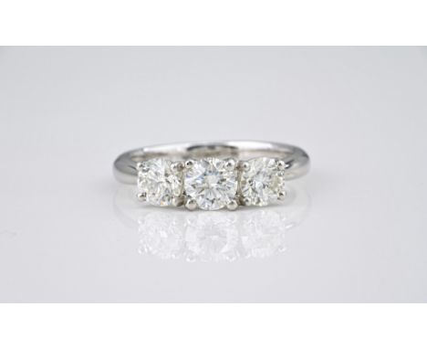 A platinum and diamond three stone ring, the three slightly graduated brilliant cut diamonds totalling 1.58ct, size M.