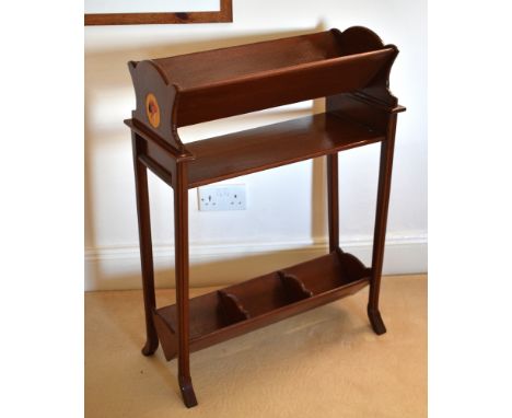 A mahogany and marquetry book trough made by Roger Perrot, the Edwardian style bookstand with inlaid roundel of a parrot's he