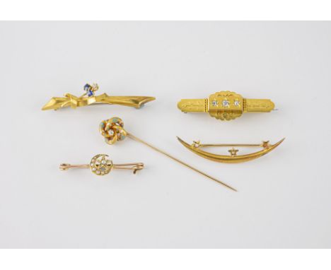 Four antique gold brooches, including a 15ct Etruscan Revival brooch set with three diamonds; a 15ct, sapphire and diamond ri