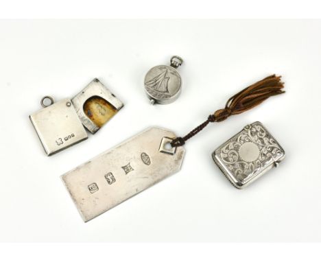 A small collection of gentleman's silver accessories, comprising a stamp case pendant by W &amp; G Neal, London, 1901; a mini