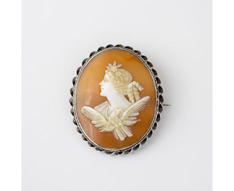 A Victorian silver cameo brooch, the shell cameo carved with a portrait of a maiden and an eagle, within a ribbon and barleyt