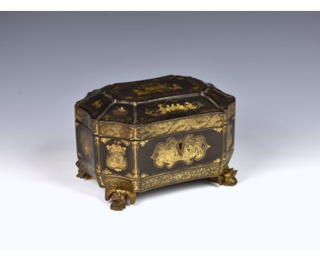 A Chinese export lacquered twin compartment tea caddy, 19th century, of octagonal form, raised on carved giltwood dragon feet