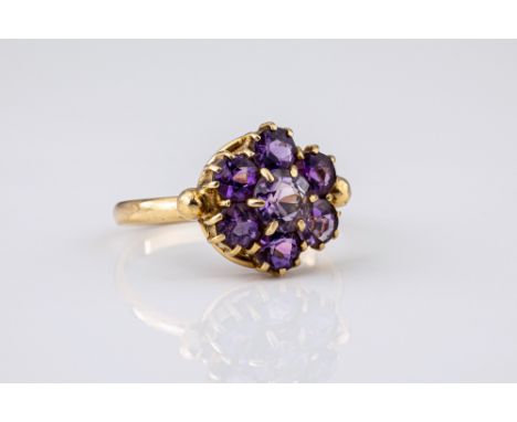 A vintage 9ct yellow gold and amethyst cluster ring, size N.