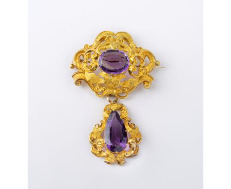 A Victorian 18ct gold and amethyst two-piece pendant brooch, the brooch with elaborate chased foliate scroll frame set with a