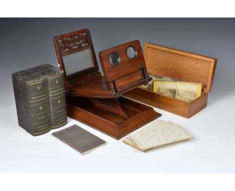 A Victorian mahogany cased stereoscopic viewer, the box opening to reveal an extra viewer on a ratchet system, 15¾in. (40cm.)