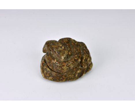 A novelty Victorian papier mache snuff box, in the form of a dog poo, the base with hinged lid, 3in. (7.6cm.) long.  *Conditi