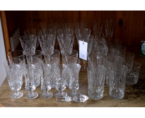 A suite of Waterford cut drinking glasses, comprising ten champagne flutes, eight red wine goblets and eight water glasses; t