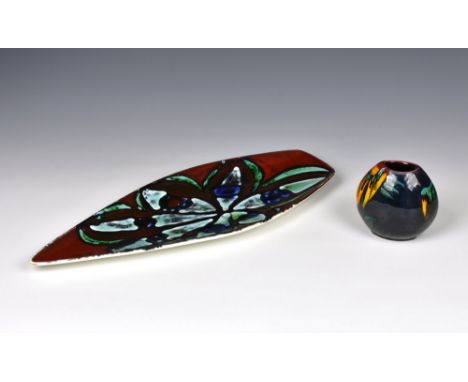 A Poole Pottery Delphis spear dish, pattern number 82, in red greens and blues, 16¾in. (42.5cm.) long, together with a Poole 