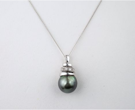A 9ct white gold, black pearl and diamond pendant necklace, on a 9ct white gold curb link trace chain. 