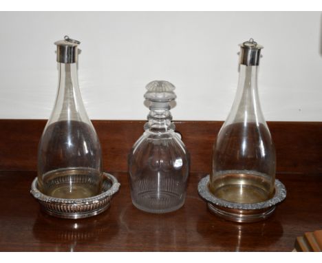 A Georgian cut glass Prussian decanter, c.1810, with triple ringed neck, petal cut shoulder and comb basal cutting, with matc