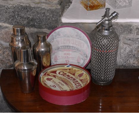A boxed set of French cheese plates, printed with vintage Art Nouveau style designs; together with a vintage soda syphon; and