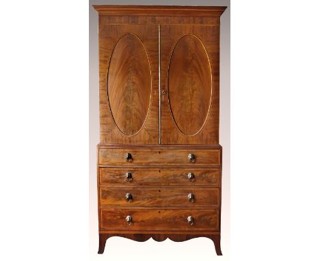 A good Regency Channel Islands inlaid mahogany linen press, the flared cornice over a trellis inlaid and barber's pole banded