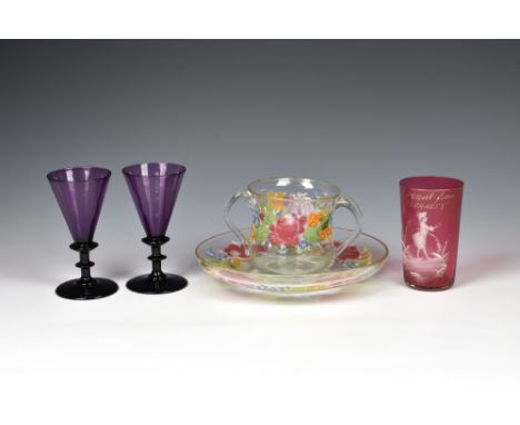 A pair of late Georgian amethyst wine glasses, c.1830, the funnel bowls with broad collar on a bladed knopped stem, the plain