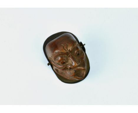 A Japanese carved boxwood Noh Mask letter clip, late 19th/early 20th century, the well carved mask with pierced eyes & nostri