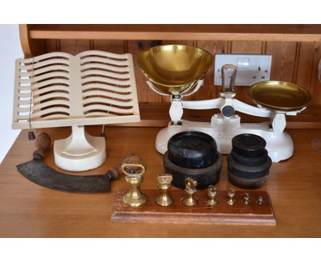 A pair of cream painted and brass Libra Scale Co. kitchen scales, with a graduated set of imperial brass weights and a nested