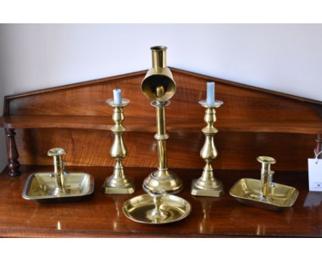 A Victorian brass hooded student lamp, together with a pair of Victorian brass candlesticks; two 19th century brass chamberst