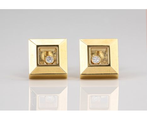 A pair of 18ct yellow gold 'Happy Diamonds' earrings by Chopard, the bevelled, square stud earrings enclosing a glazed window