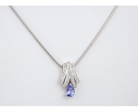 A 9ct gold, Tanzanite & diamond pendant necklace, the pearl cut Tanzanite below a diamond set fan, on a 9ct white gold snake 