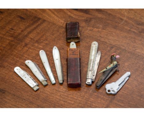 A novelty antique two bladed horn penknife, fashioned as an exotic bird, 2¾in. (7cm.) long; together with various mother of p