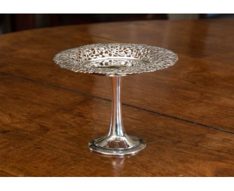 An exquisite Chinese silver tazza, unmarked, the border with ornate pierced decoration of birds amidst prunus flower, raised 