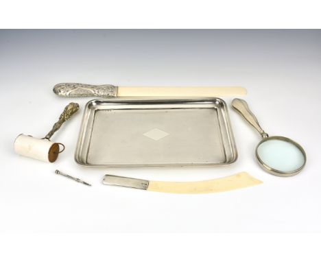 A collection of silver desk accessories, comprising a silver handled magnifying glass by Henry Mathews, London, 1902; a recta