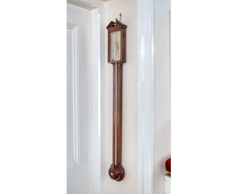 A George III strung mahogany stick barometer by A. Grigo of Holborn, the broken architectural top over a silvered rectangular