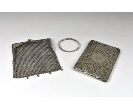 A late Victorian silver card case, Stokes &amp; Ireland Ltd, Chester, 1900, of shaped rectangular form, the entire profusely 