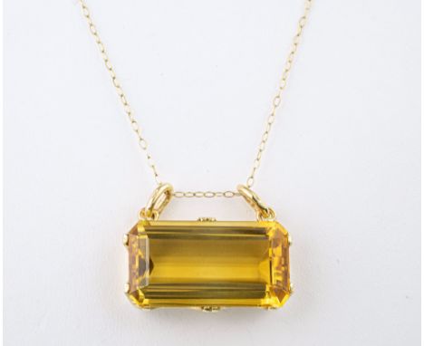 A vintage 14ct yellow gold and citrine pendant necklace, 1950s-60s, the large, 25 x 14mm. emerald cut citrine with double sus